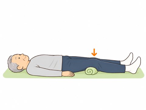 あお向けで足を伸ばし、膝の下のタオルを膝で押しつけているイラスト